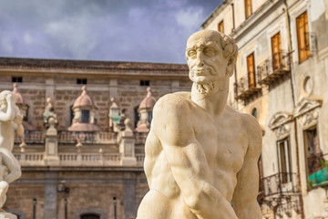Obraz premium Statue of man in Praetorian Fountain in centre of Piazza Pretoria with detail of ancient Greek Mythology, Palermo