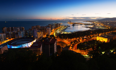  Malaga with Port from castle in  twilight time.   Spain