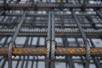 Billets of reinforcement at the construction site. Construction of the building with the help of reinforced concrete. Reinforcement of concrete base.