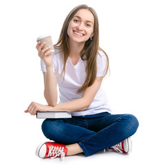 Woman sitting reading book and drink cardboard cup of coffee on white background isolation