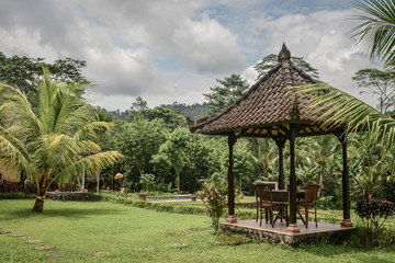 Gazebo with table and chairs at garden