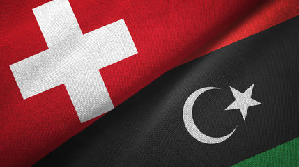 Switzerland and Libya two flags textile cloth, fabric texture