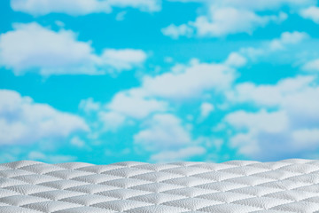 Quilted leather on table and blue sky background