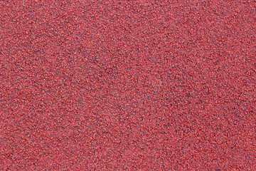 Running track sports texture. Running track rubber cover. Tartan track material is the trademarked all-weather synthetic track surfacing for athletics made of polyurethane. Red tartan athletic running