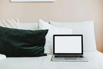 Bright home office desk workspace with mock up screen copy space laptop. Nordic modern minimal...