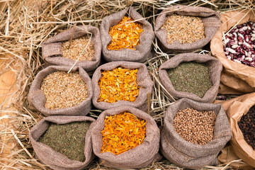 Cloth bags with fresh Indian spices on the counter