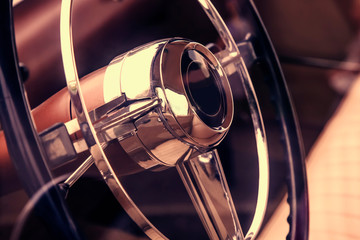 Interior of a classic vintage car. Close up on a dashboard. Road, travel, retro concept