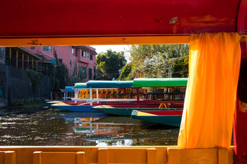 Boats Framed through Window of Another Boat at Xochimilco in Mexico City