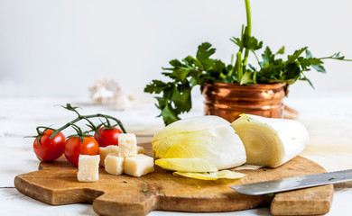 composition of fresh vegetables pans and cutlery