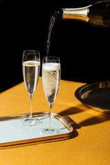 Flutes filled with sparkling Prosecco, in pop contemporary style. Prosecco is an italian white sparkling wine cultivated and produced in Valdobbiadene-Conegliano area. © Maurese