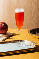 Tintoretto, an italian cocktail with 2/3 Prosecco (or Champagne) and 1/3 pomegranate juice, served in a flute. Pop contemporary style