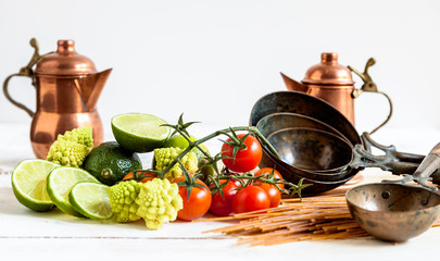 composition of fresh vegetables pans and cutlery