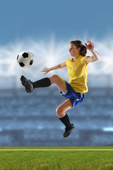Fototapeta premium Young Woman Playing Soccer