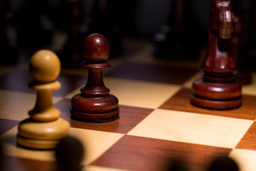 White and black chess pawls. Close up. E2-E4 classic start.