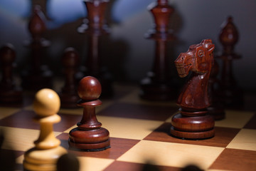 White and black chess pawls. Close up. E2-E4 classic start.