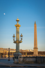 Fototapeta na wymiar Paris, France - 02 17 2019: Place de la Concorde and the Obelisk of Luxor and the moon