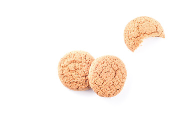 Composition with one bitten from oatmeal cookies on a white background, isolate