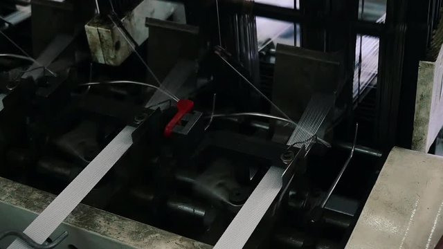 Loom creates fabric from needles and threads, slow shooting