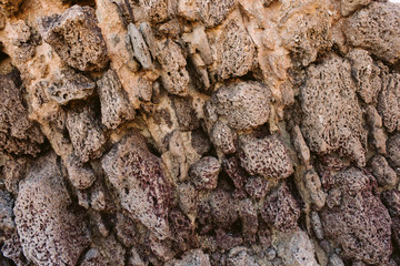 Rock texture and background for design. Close up view of rocks in the seashore. Natural rock texture.