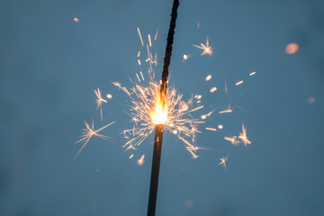 Cold sparklers on a blue background