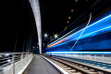 Citadelle Bridge across Bassin Vauban for trams and bicycles. Night view.