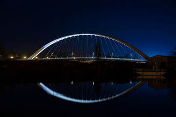 Citadelle Bridge across Bassin Vauban for trams and bicycles. Night view.