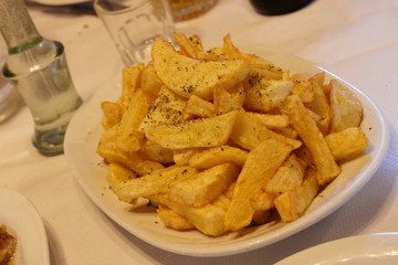 French fried potatoes served on restaurant table
