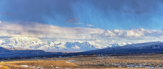 Winter Panoramic view of Snow capped Wasatch Front Rocky Mountains, Great Salt Lake Valley and...