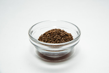 Cumin isolated on a white background. Cumin placed on the table. The concept of using seasonings for dishes. Eating spiced dishes.