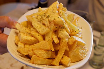 French fried potatoes served on restaurant table