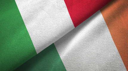 Fototapeta na wymiar Italy and Ireland two flags textile cloth, fabric texture