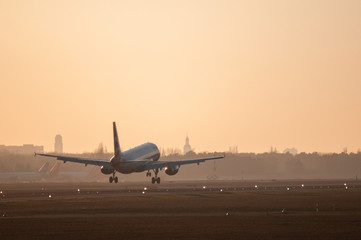 Fototapeta na wymiar landing airplane at airport tegel in the afternoon 1