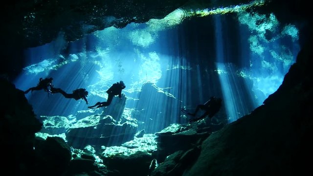 scuba diver exploring a cave