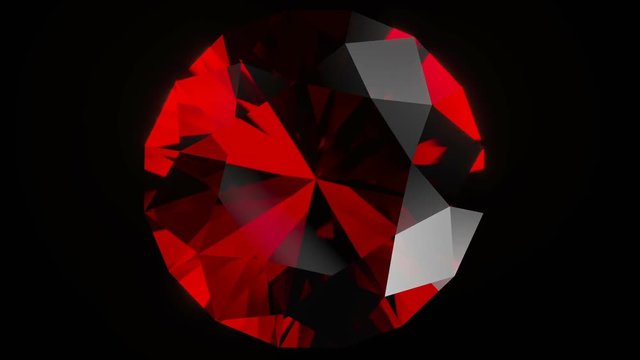 Realistic ruby gemstone isolated on black background.
