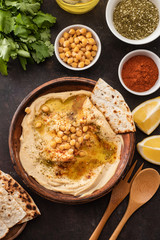 Classic Hummus with chickpeas, paprika, olive oil and oriental spices. Mediterranean popular snack of chickpeas and tahini pasta.