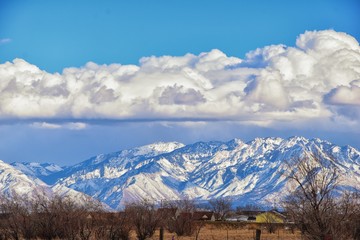 Winter Panoramic view of Snow capped Wasatch Front Rocky Mountains, Great Salt Lake Valley and...