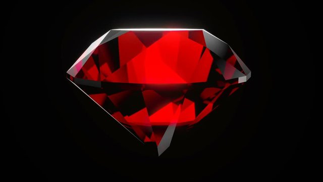 Realistic ruby gemstone isolated on black background.