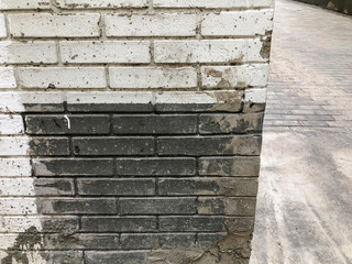 Brick wall. Architecture. Gray and white stone. Brick building