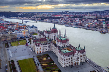 Budapest, Hungary - Aerial view of the Parliament of Hungary with Szechenyi Chain Bridge, Buda Castle Royal Palace, Matthias Church and Fisherman's Bastion at background at sunset