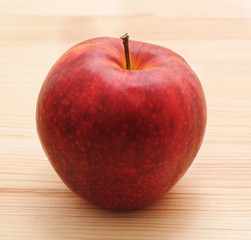 Red apple on a table.