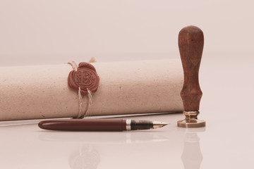 Fountain pen and old notarial wax seal on document