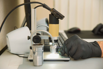 Electronic microscope for fitting and improving dentures and implants with output to the monitor