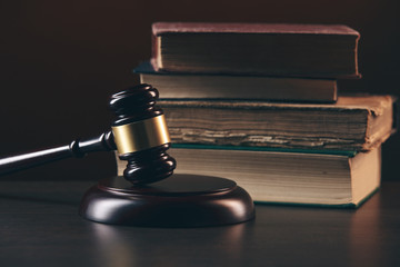 Judge gavel and legal book on wooden table, justice and law concept