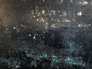 Dirty wall painted in black full of imperfections