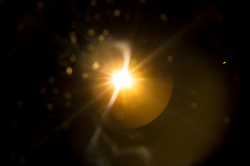 Abstract Natural Sun flare on the black background.
