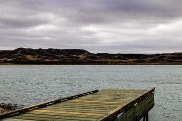 Fototapeta na wymiar Gloomy stormy skies hang over Diefenbaker Lake, Saskatchewan Landing Provinical Park, Saskatchewan, Canada