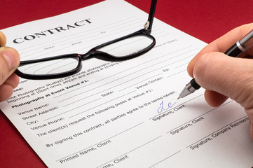 Glasses and document contract close up.