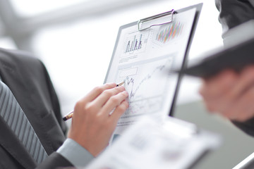 Close up businessman working with graph data at office