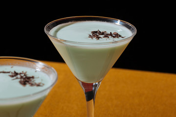 Grasshopper cocktail, an old classic from New Orleans, with green creme de menthe. white creme de cacao and light cream (or single cream in UK, half and half in USA)
