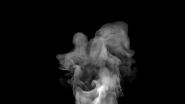 White steam spins and rises from the pan. White smoke rises from a large pot, which is located behind the frame. Isolated black background.